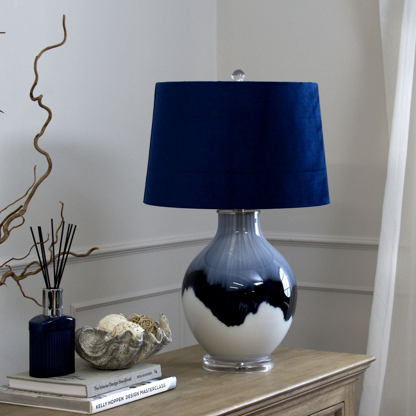 hand-dipped glass table lamp, unlit on sideboard