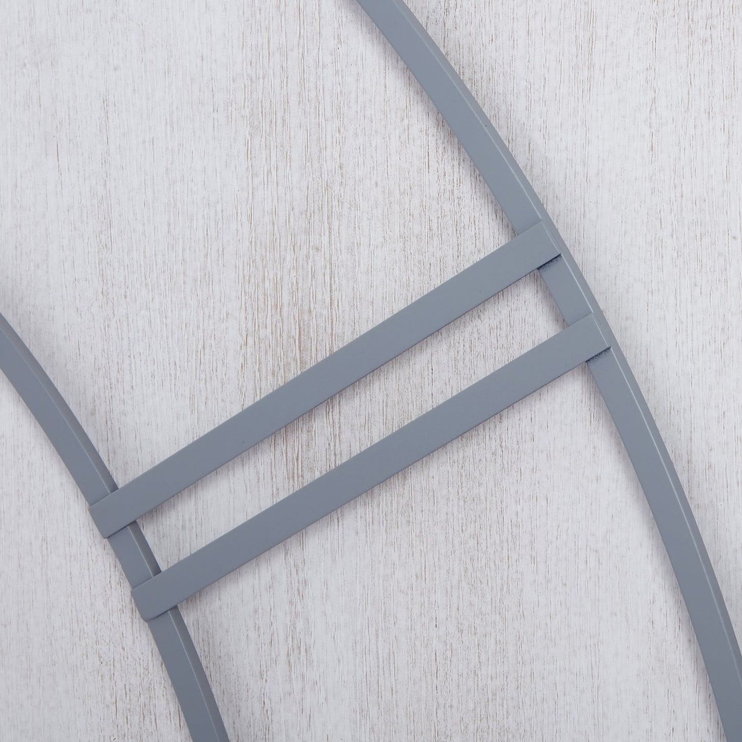 close up of roman numerals on large 3 panel wall clock