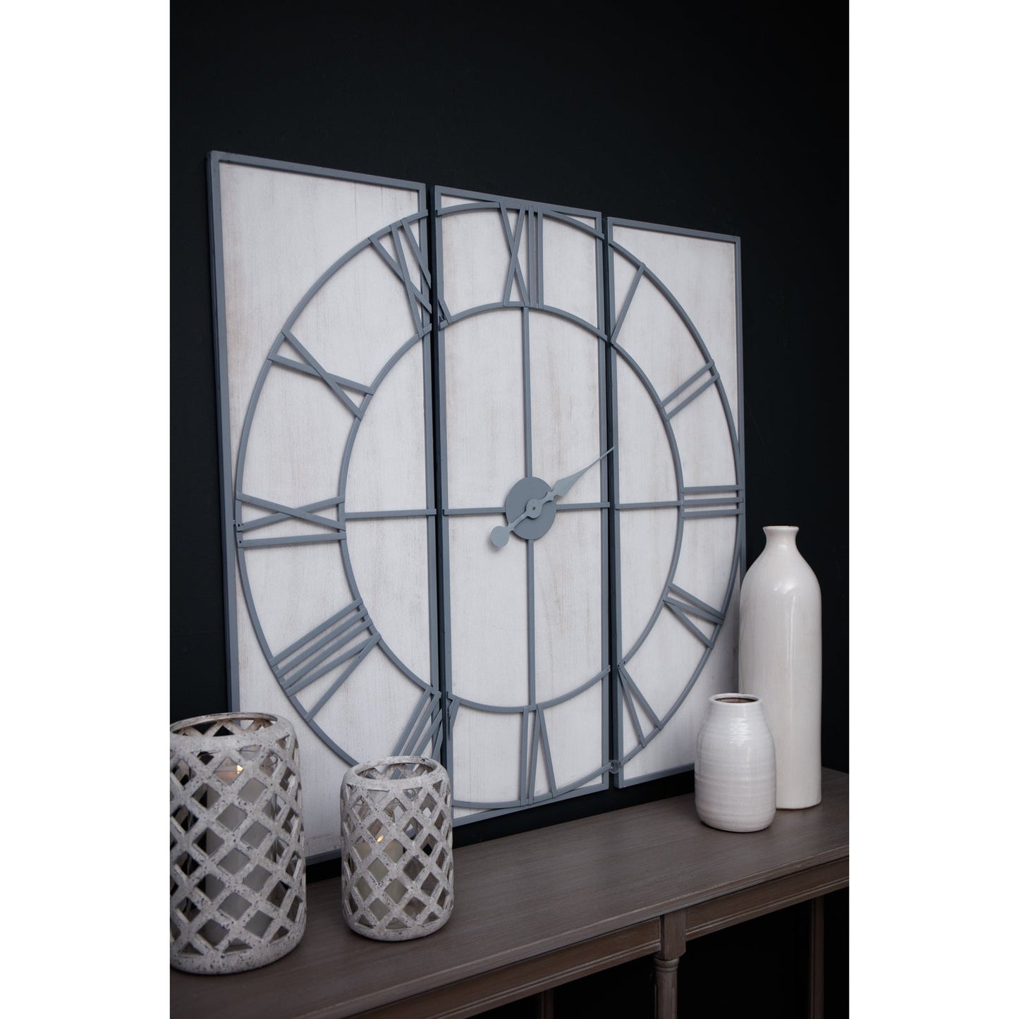 large 3 panel wall clock above console table