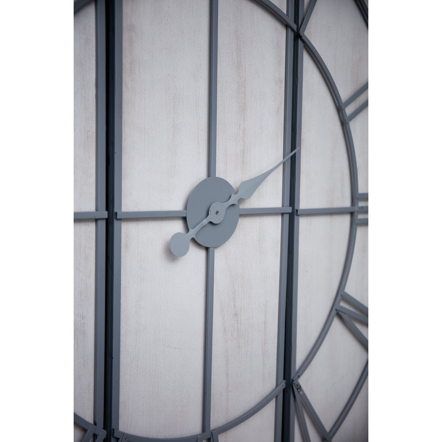 angled view of centre of large 3 panel wall clock