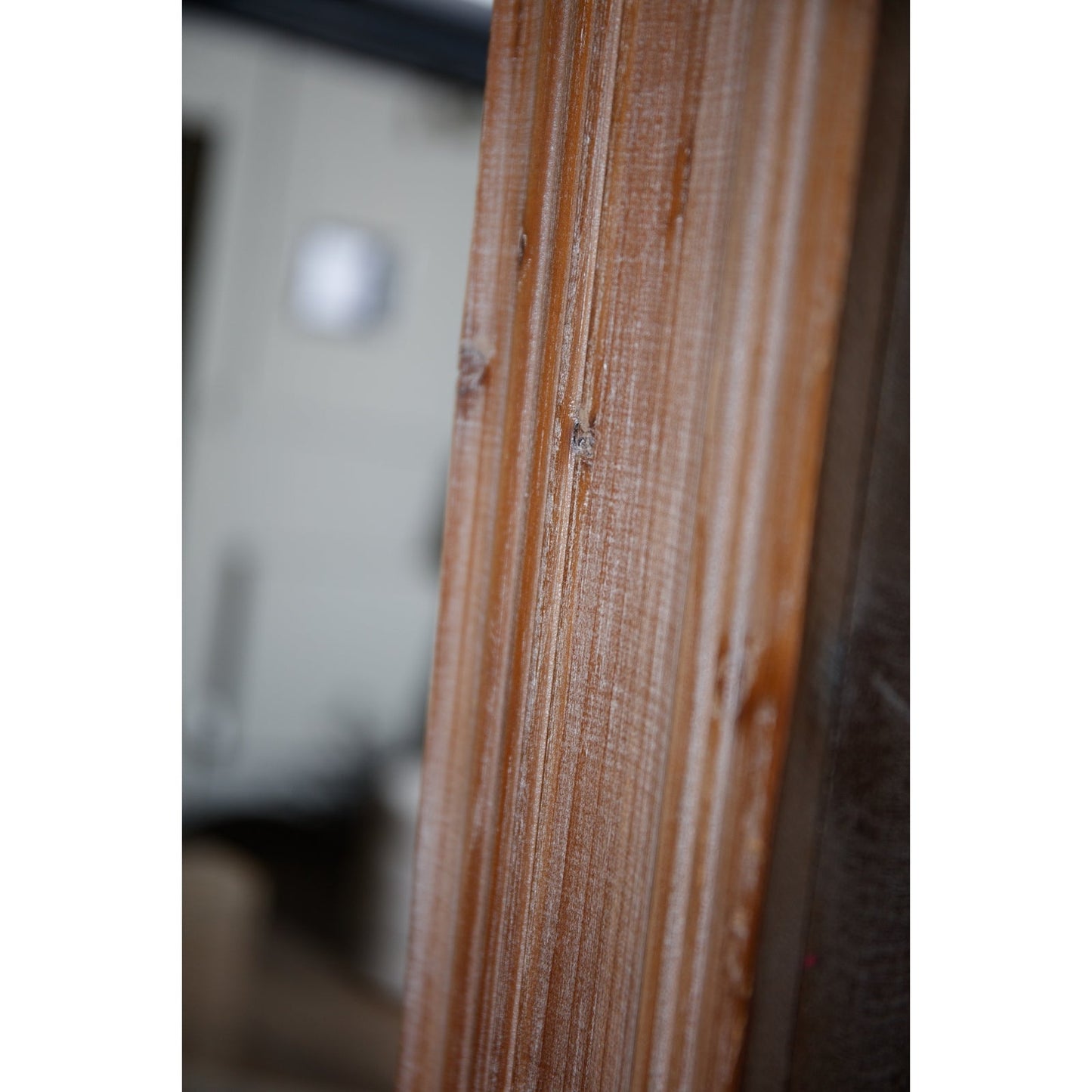close up of the washed wood frame on washed wood large mirror