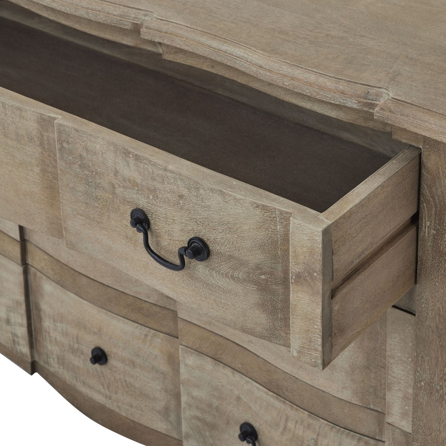 open drawer of wooden chest of drawers