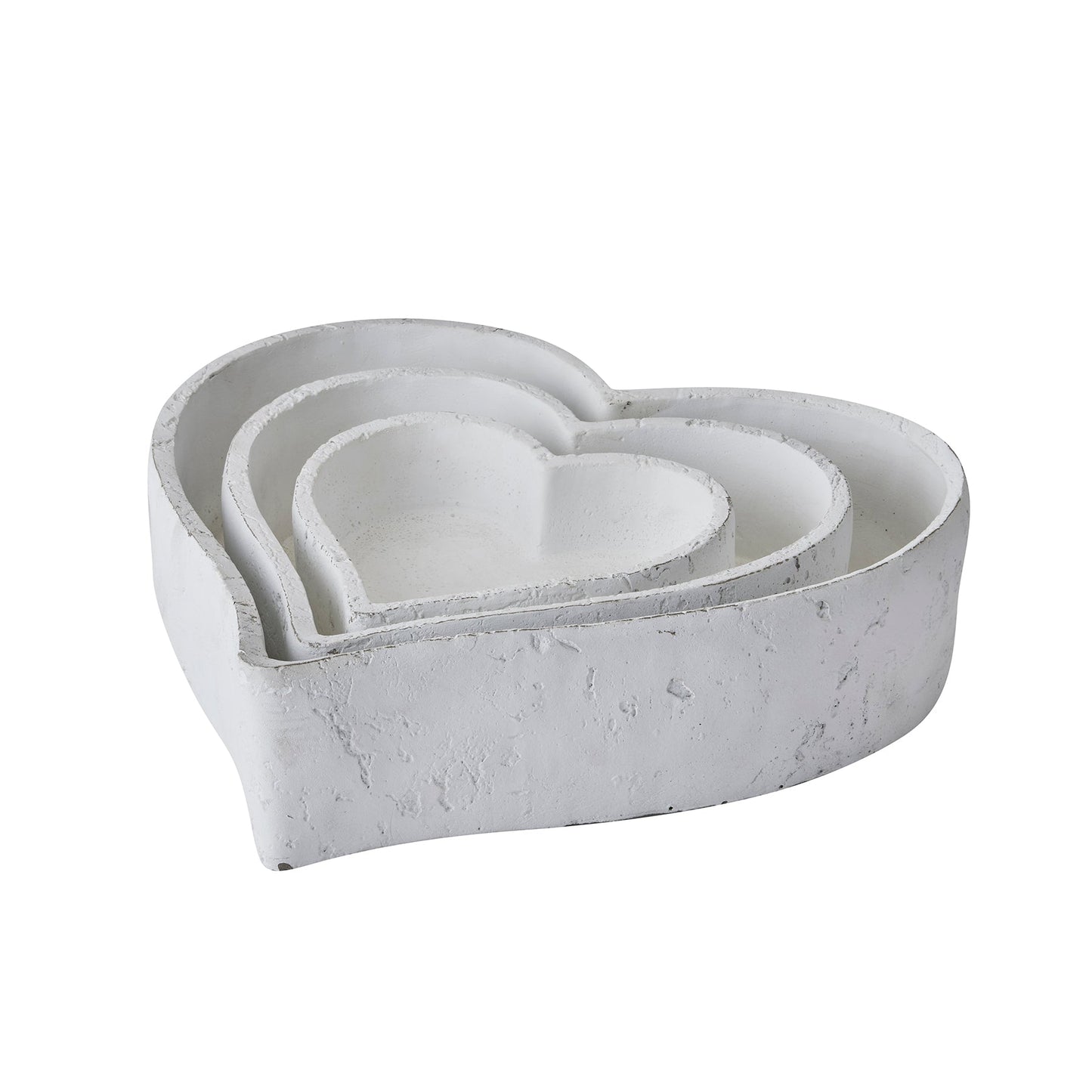Matte white set of three heart shaped dishes, sat inside one another