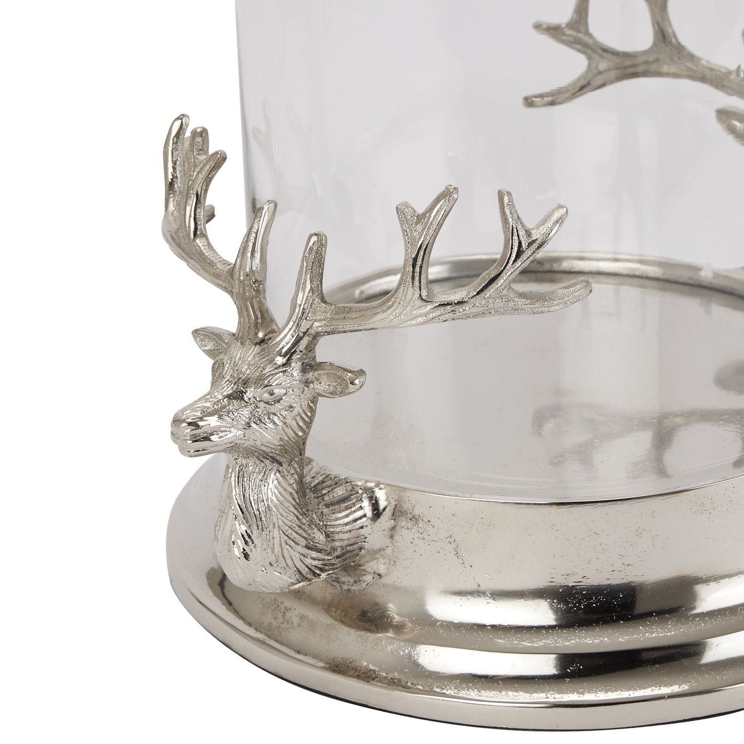 Close up of one of the Stag Heads that is either side of the glass hurricane lamp