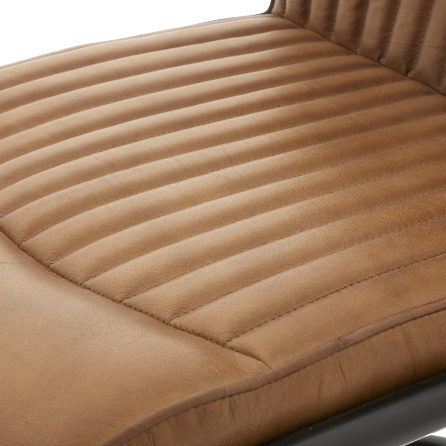 close up of the seat on tan real leather dining chair