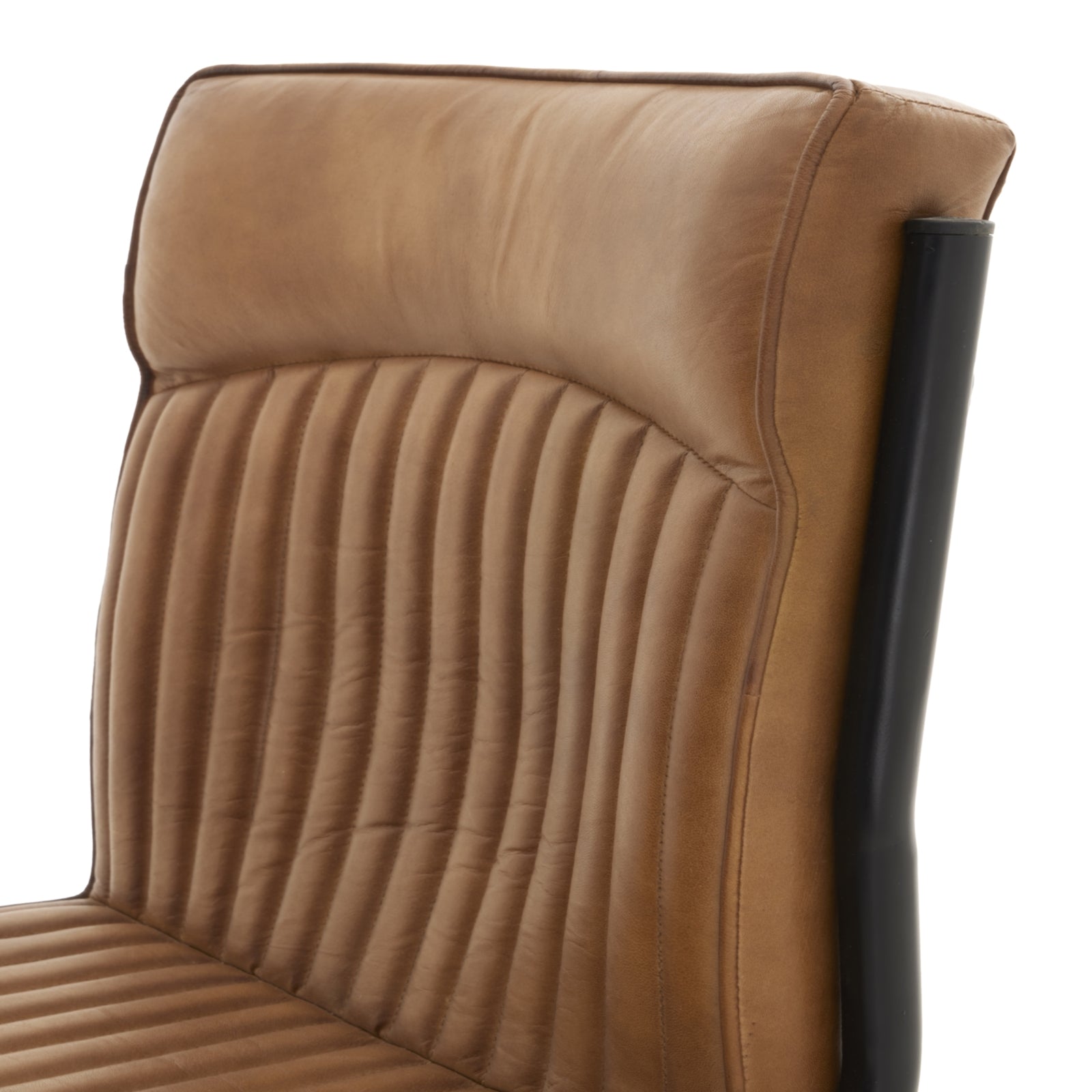 back rest of the tan real leather dining chair
