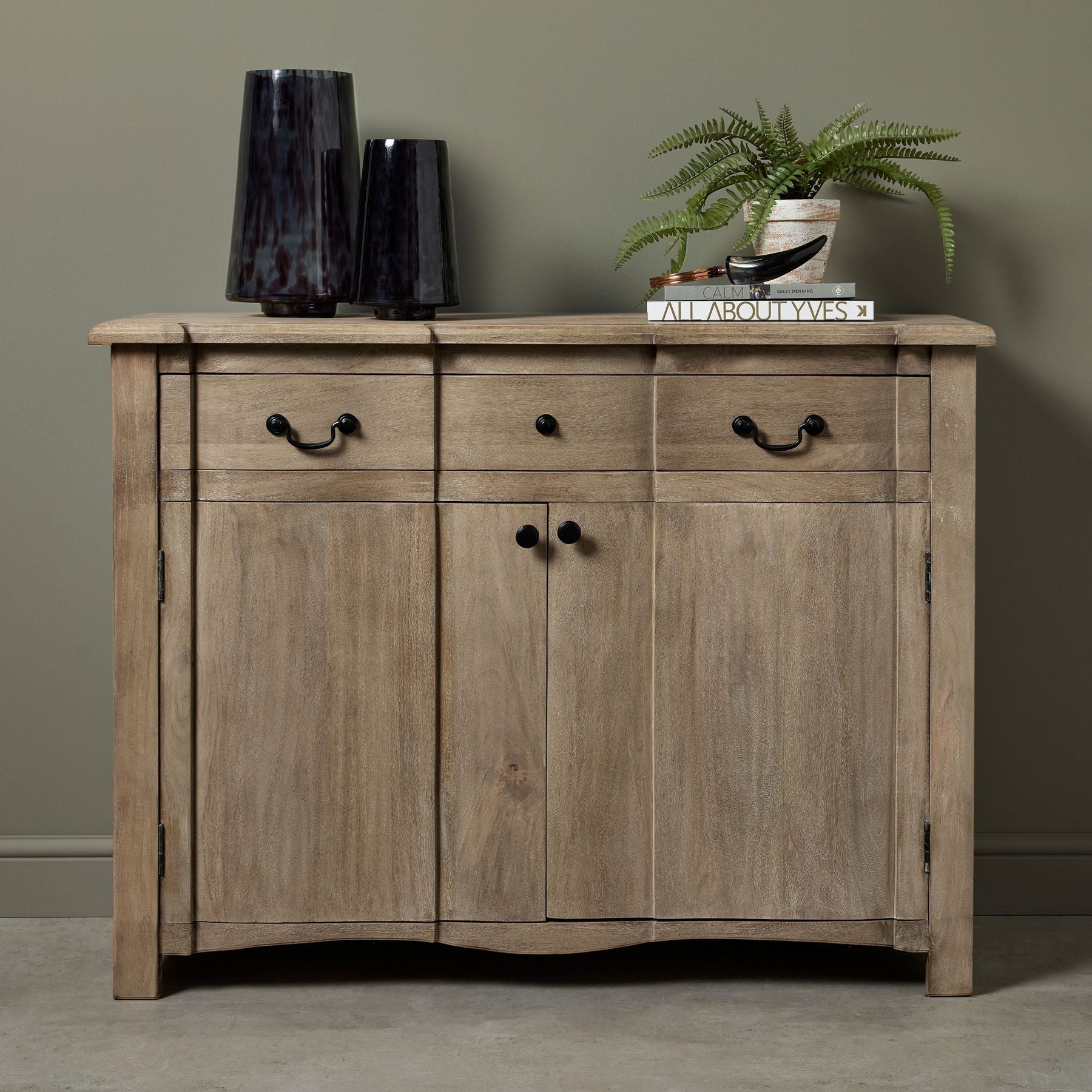 small sideboard Cotswold furniture, with vases and artificial plant on top