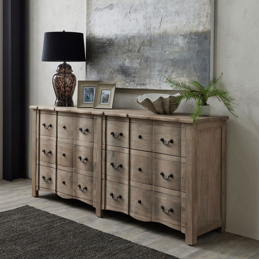 6 drawer chest of drawers with lamp and decor pieces on top