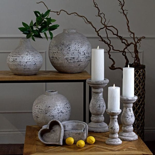 All 3 Aged Stone candle holders displayed with ribbed LED Flameless candles, and aged stone vases.