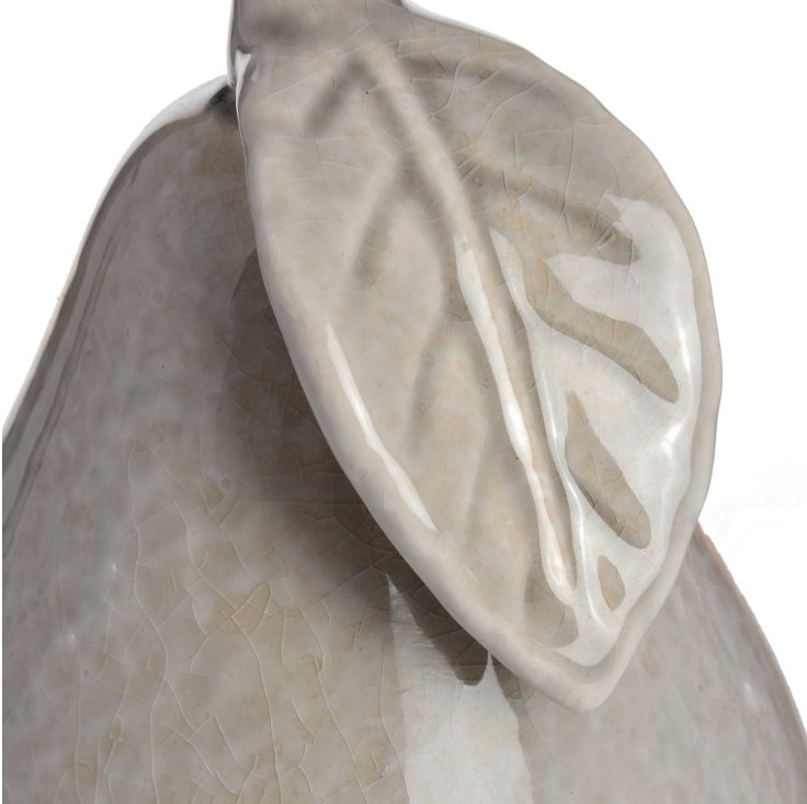 Close up detail showing leaf, with crackle detail to the ceramic