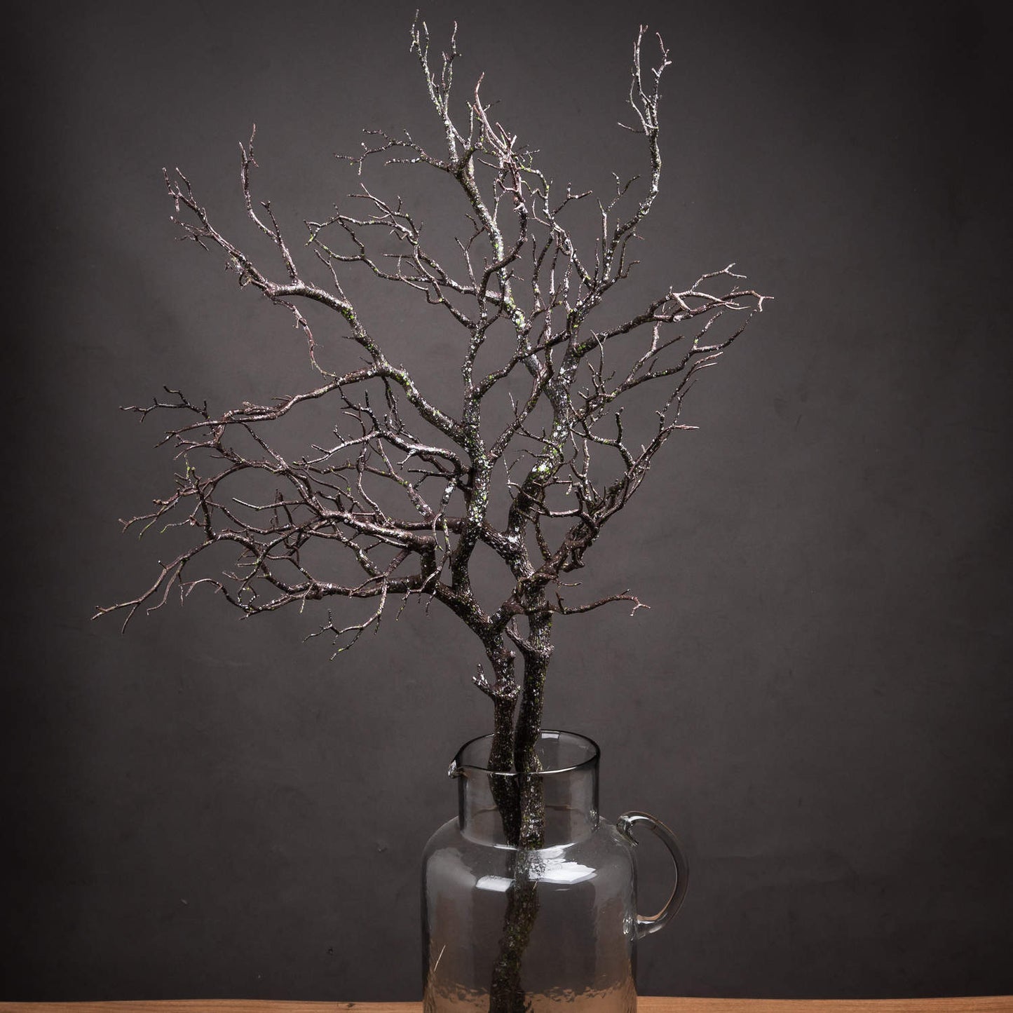 two large branch sprays in clear glass jug
