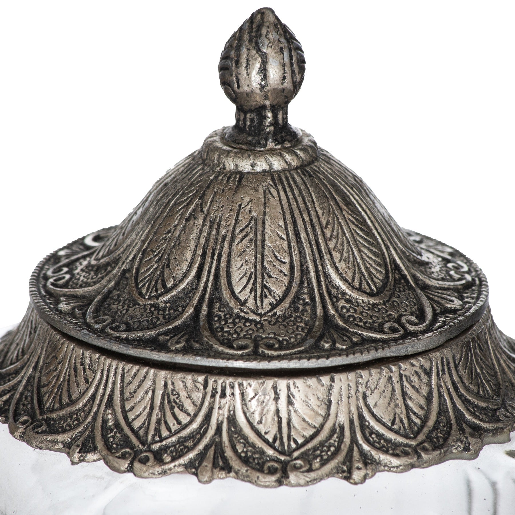 close up of the metal lids with the intricate detail and finial top
