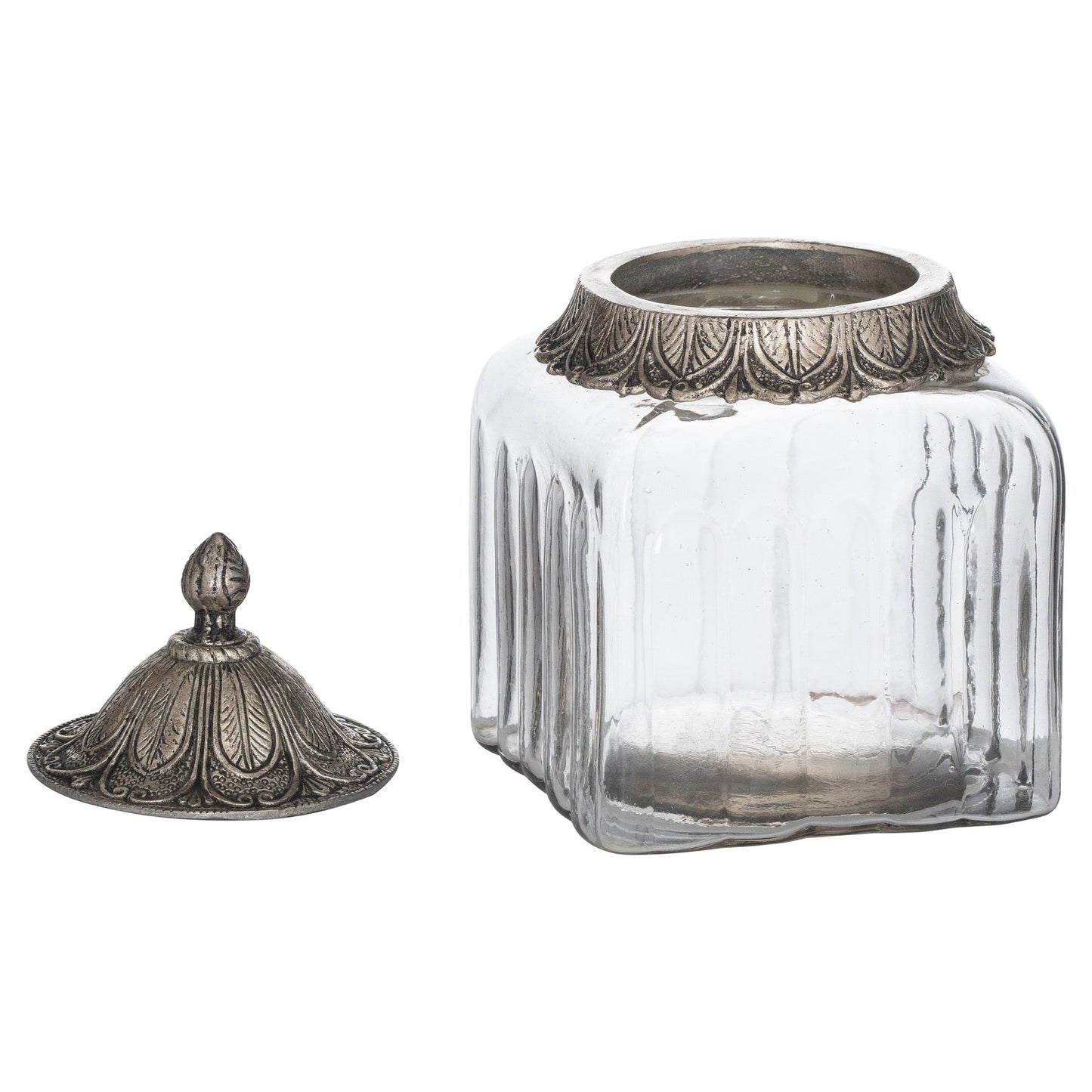 small handblown glass jar with the lid off and laid to the left side